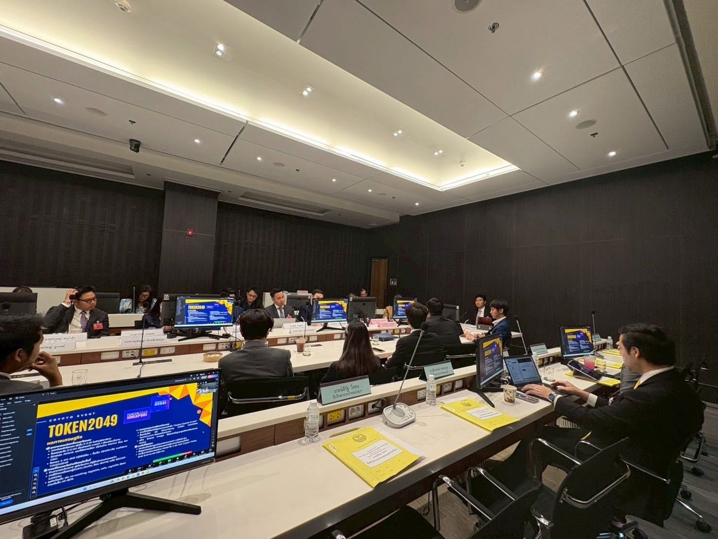 Committee meeting at the Parliament of Thailand with presentation slides on the screens